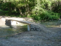A pedestrian and for cicle bridge made of wooden planks A pedestrian and for cicle bridge made of wooden planks